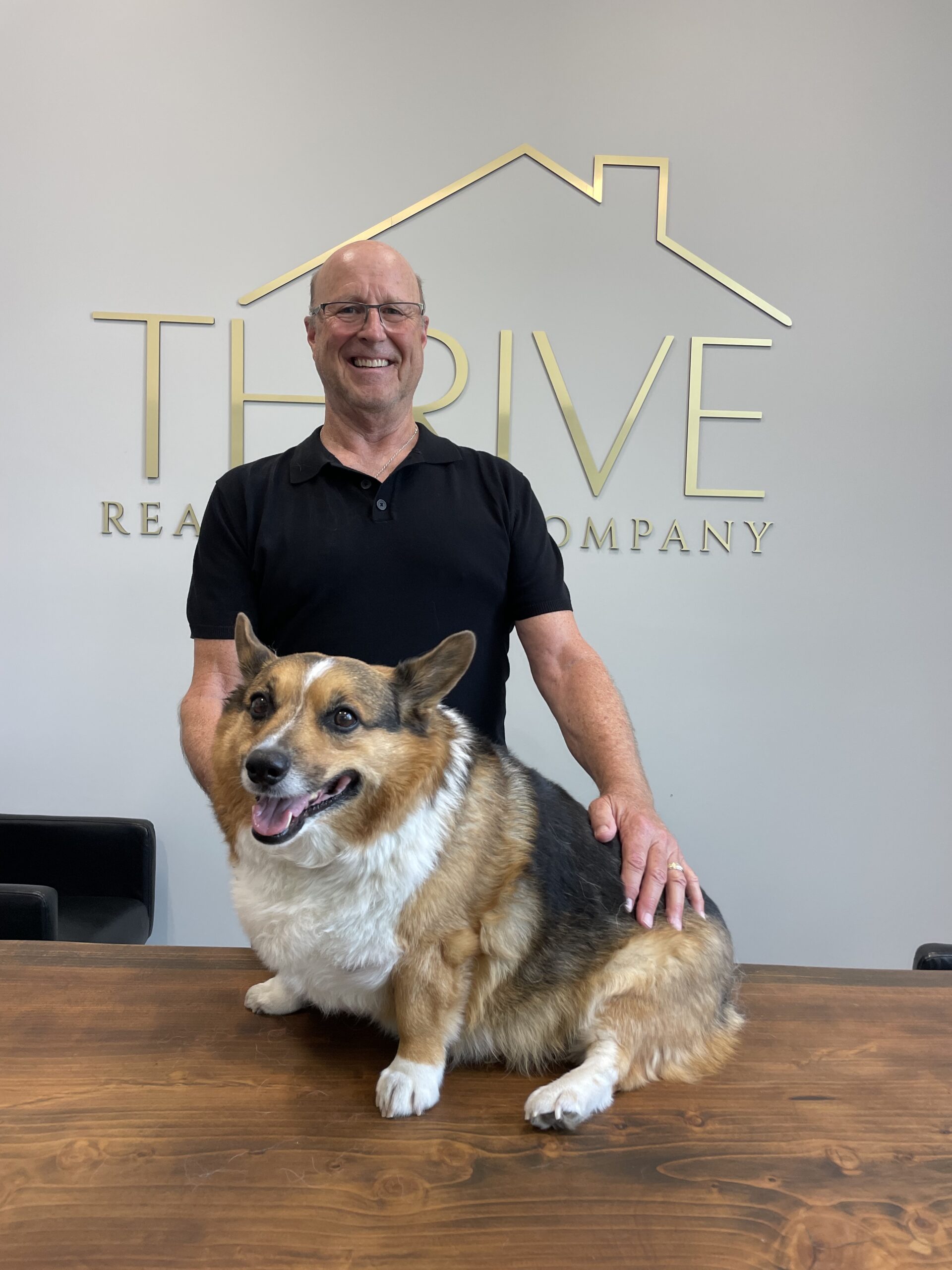 a person standing next to a dog